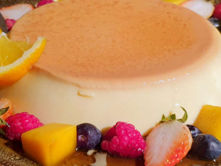 Selective focus of pudding with raspberries, orange, kiwi, mango, strawberry and apple as a...