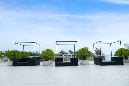Beach lounge chair with blue sky on the hotel deck, Sundeck for vacation and summer, Space for text in templateの写真素材