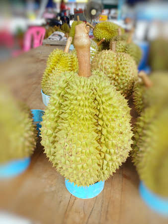 Top view of durian fruit on wooden table for sale in the market, Tropical fruit, copy space...