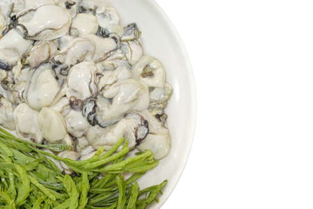 Thai food style, Soft Focus of fresh Oysters with vegetables acacia isolated on white background, ready for eat or serving, Selective focusの写真素材