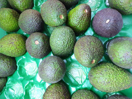 Soft focus of fresh avocado as a background for sale in the supermarket, ready to eat or making drinks and saladsの写真素材
