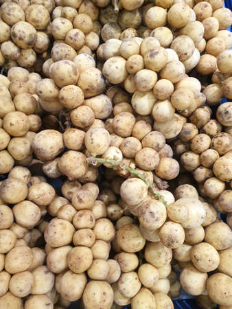 Top view of fresh longkong as a background for sale in the supermarket, Ready to eat (Lansium...