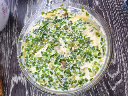 Top view of Steamed egg with scallion sliced in big bowl on wooden table in restaurant ready to eat, Kai thoon is Thai traditional (Chawanmushi), Clean food of healthy conceptの写真素材