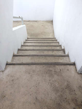 Concrete stairs going down, Abstract image background, Space for text in template, Verticalの写真素材