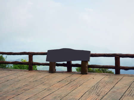 Large wooden signs placed on the balcony with mist in the morning at Ang Khang - Chiang Mai,...