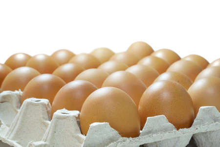 Selective focus of eggs in paper tray package isolated on white background, use for cooking