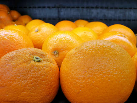 Selective focus of orange fruit for sale in the market on blurred background, Fresh Tangerine...