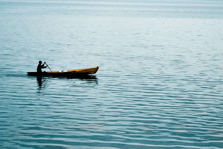 Silhouette of boats on the lakeの写真素材