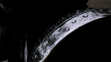 beautiful water drop on the top of metal circleの写真素材