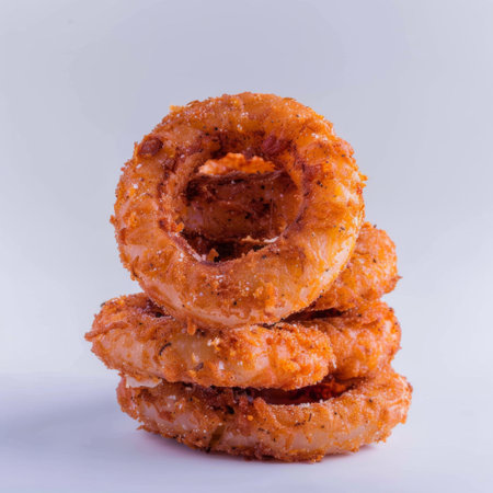 A stack of doughnuts perched on top of each other.の素材