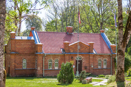 Pelci, Kuldiga, Latvia, Mai 19, 2018: Parish People's House. Cultural Center. It was builded in 1893 and renewed in 1989. Made of red bricks.のeditorial素材