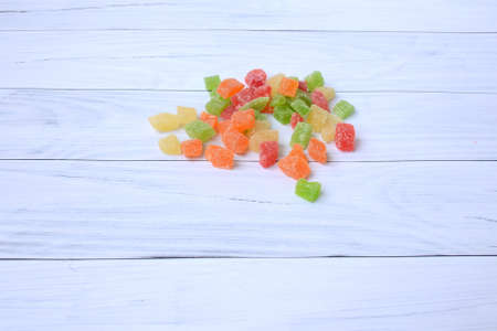 Pineapple slices on a background of white, old, wooden boards. Four colors. Candied fruit. copyspace.の写真素材