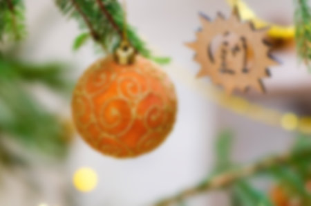 Christmas ball fir branch, blurred photo for festive textureの写真素材