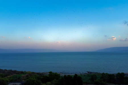 Landscape of the Sea of Galilee - Sea of Galilee. The lake against the sunset sky.の写真素材