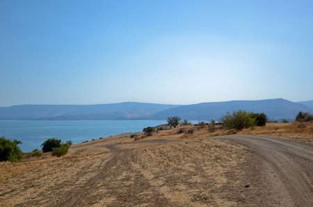 Landscape of the Sea of Galilee - Sea of Galilee. road through agricultural fieldsの写真素材
