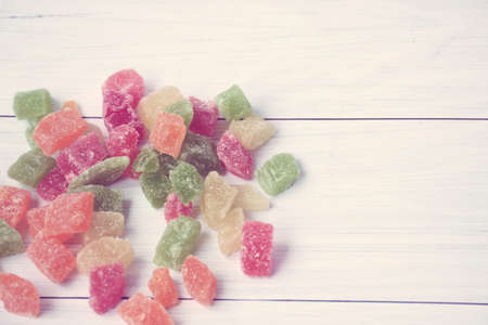 Pineapple slices on a background of white, old, wooden boards. Four colors. Candied fruit. The photo is tinted. copyspace.の写真素材
