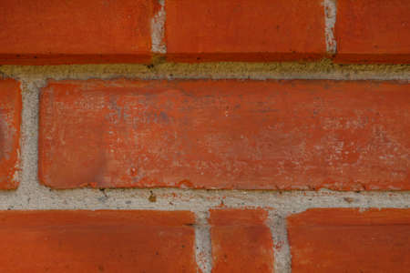 Brick wall from red bricks close-up. horizontal building texture