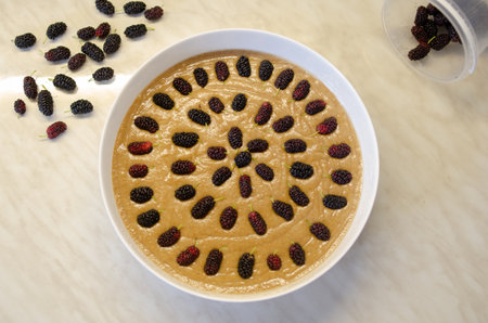 Pie with delicious mulberries in a white dish. home food conceptの写真素材