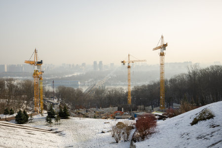 Construction site with cranes. Steel frame structure, structural steel beam create large architectural buildings on construction site.の写真素材