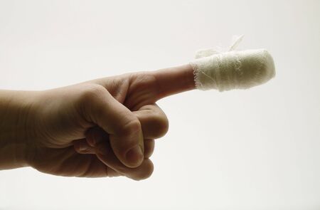 laceration; finger; bandage; plea; hand; morning; wound; first aid; knife; treatment; medicine; background; blood; palmの写真素材