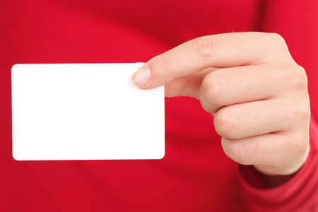 Person showing business card. Closeup of woman holding blank empty business card.の写真素材