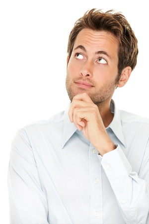 Thinking man isolated on white background. Closeup portrait of a casual young pensive businessman looking up at copyspace. Caucasian male model.