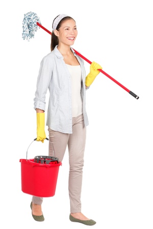 Cleaning woman with mop and bucket washing floor walking smiling happy doing spring cleaning. の写真素材