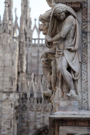 Statue on the Milan Cathedral. Gothic architecture の写真素材
