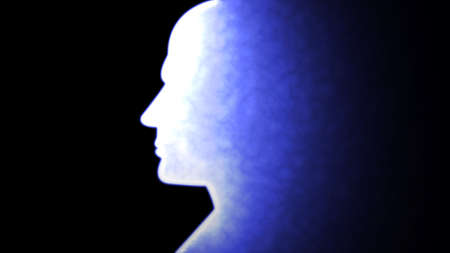 Human/AI Head Silhouette with Glowing Vibrant Blue Color Effect Screen in Black Backgroundの写真素材