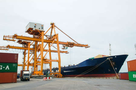 Bangkok, Thailand - Mar 14, 2006: the Port Authority of Thailand. With a cargo ship to harbor cranes loading containersのeditorial素材