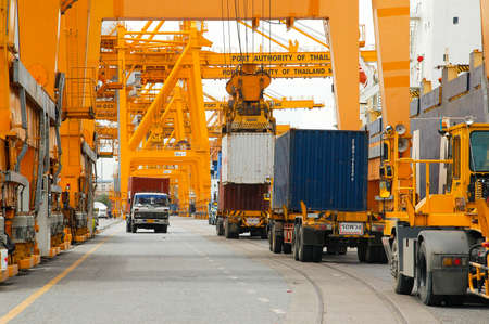 Bangkok, Thailand - Mar 14, 2006: the Port Authority of Thailand. With a cargo ship to harbor cranes loading containersのeditorial素材