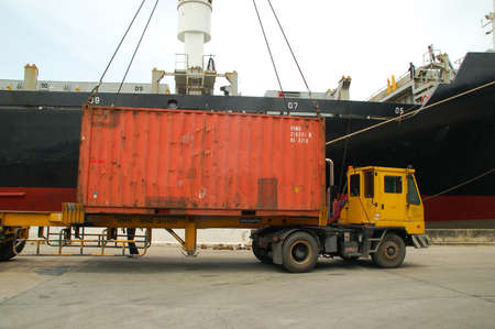 Bangkok, Thailand - Mar 16, 2006: the Port Authority of Thailand. With a cargo ship to harbor cranes loading containersのeditorial素材