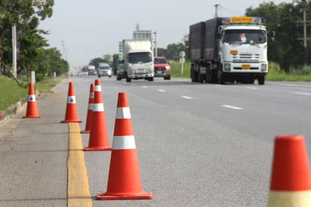 Bangkok, THAILAND - October 3, 2018: Orange traffic cone and diversion on country road,Thailand.のeditorial素材