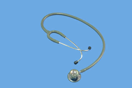Closeup of a medical stethoscope on Indigo background with cipping pathの写真素材