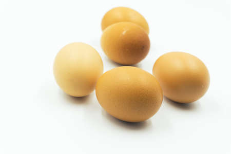 Chicken eggs in carton box on white background.