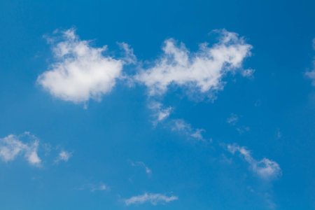 Blue sky background with tiny clouds. Nature cloud blue sky background.の写真素材