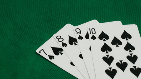 A pile of Poker playing card, playing cards on green background.;の写真素材