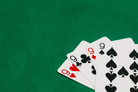 A pile of Poker playing card, playing cards on green background.;の写真素材