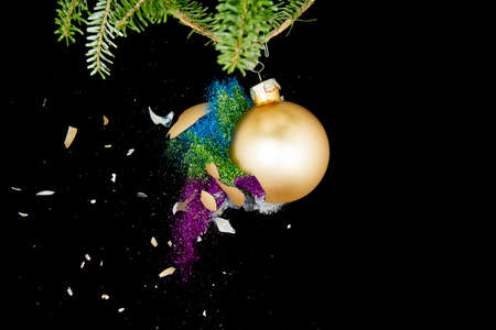 Christmas ball exploding. Glitter flying out.の写真素材
