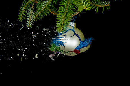 Christmas ball exploding. Glitter flying out.の写真素材