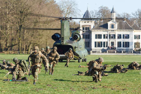 Olst Feb 7 2018: Army and Air Force helicopter exercise. Chinook landing to drop soldiersのeditorial素材