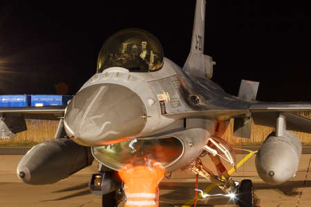 Leeuwarden Feb 6 2018: Night flight Exercise. Mechanics inspecting the engine of an F-16 Fighting...