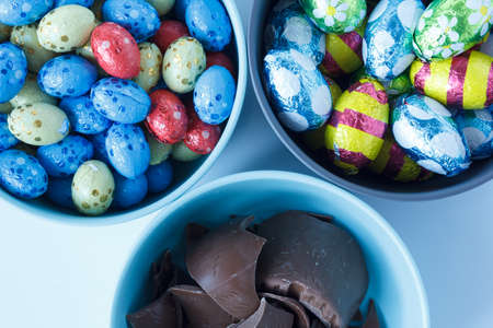 Chocolate easter eggs and pieces of a chocolate easter bunny