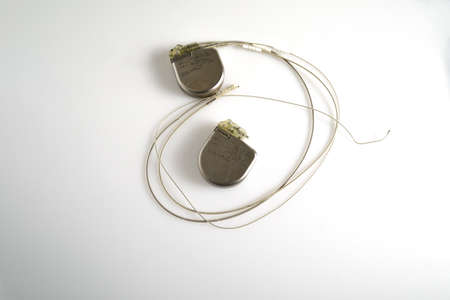 An Implantable Cardioverter Defibrillator or ICD pacemaker with leads and modem for telemonitoring at home. The device sends data to the hospital on a regular basis.の写真素材