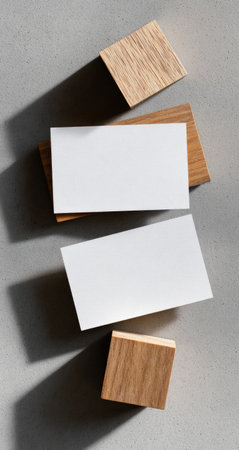 Blank business cards on light wood blocksの素材