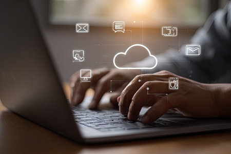 Person using laptop with cloud computing interfaceの素材