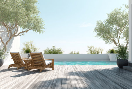 Two wooden lounge chairs face a swimming pool in this outdoor scene. The composition features a bright blue sky, dappled sunlight on the wooden deck, and various greenery. This image could be used in a variety of applications, including travel promotions and lifestyle content.の素材