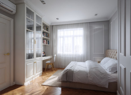 This interior image showcases a modern bedroom with a bed, desk, and built-in closet. The scene features neutral colors, natural light, and a clean aesthetic. It might be suitable for use in architectural, design, or lifestyle-related promotional materials. The composition and lighting create a peaceful atmosphere.の素材