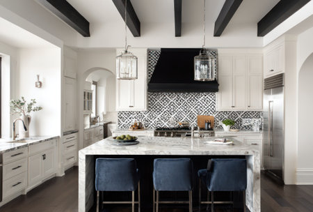 A well-lit kitchen space features an island with seating, complemented by decorative pendant lights. The design incorporates black and white geometric tile, and overhead beams add architectural interest. This setting presents potential for illustrating home design, real estate, and lifestyle content.の素材