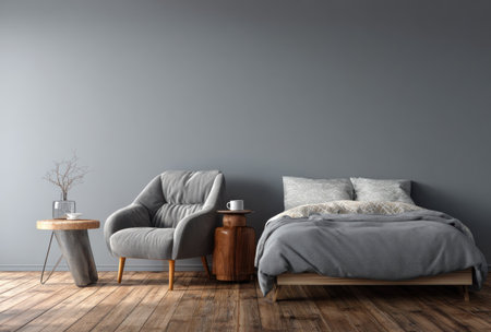 This interior scene showcases a bedroom with a minimalist design. Featuring a gray color scheme, it includes a bed, armchair, and side tables. The wooden floor adds warmth, while the composition suggests a calm and relaxing environment. This image is suitable for various commercial uses, including lifestyle and design projects.の素材